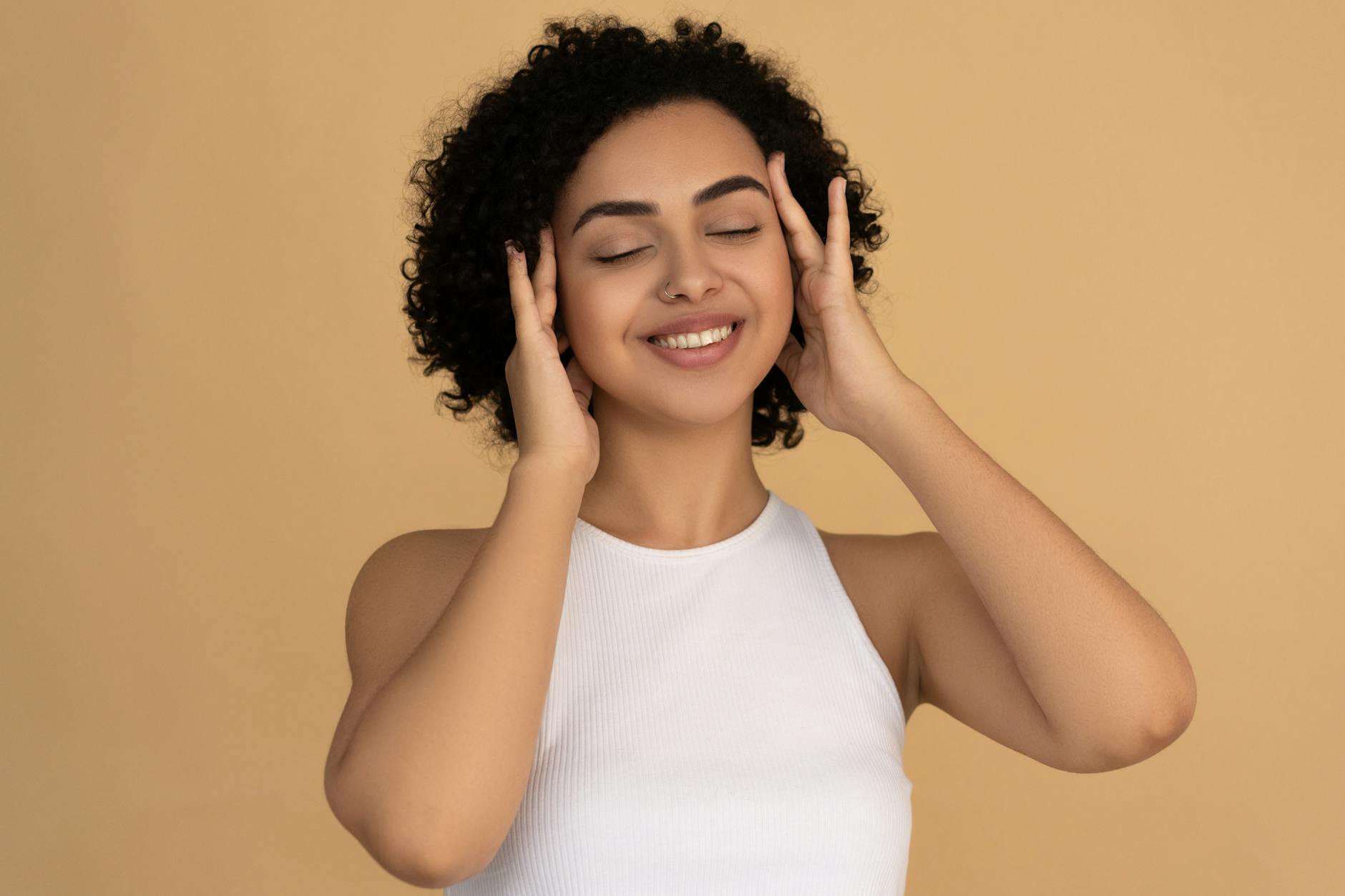 smiling woman in white tank top after taking chef mossea sea moss
