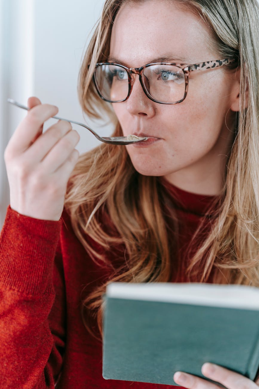 woman in red sweater wearing eyeglasses eating chef mossea sea moss